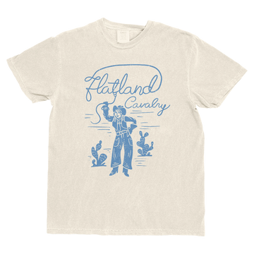 Beige t-shirt with blue graphic design of a cowboy and cacti on a white background