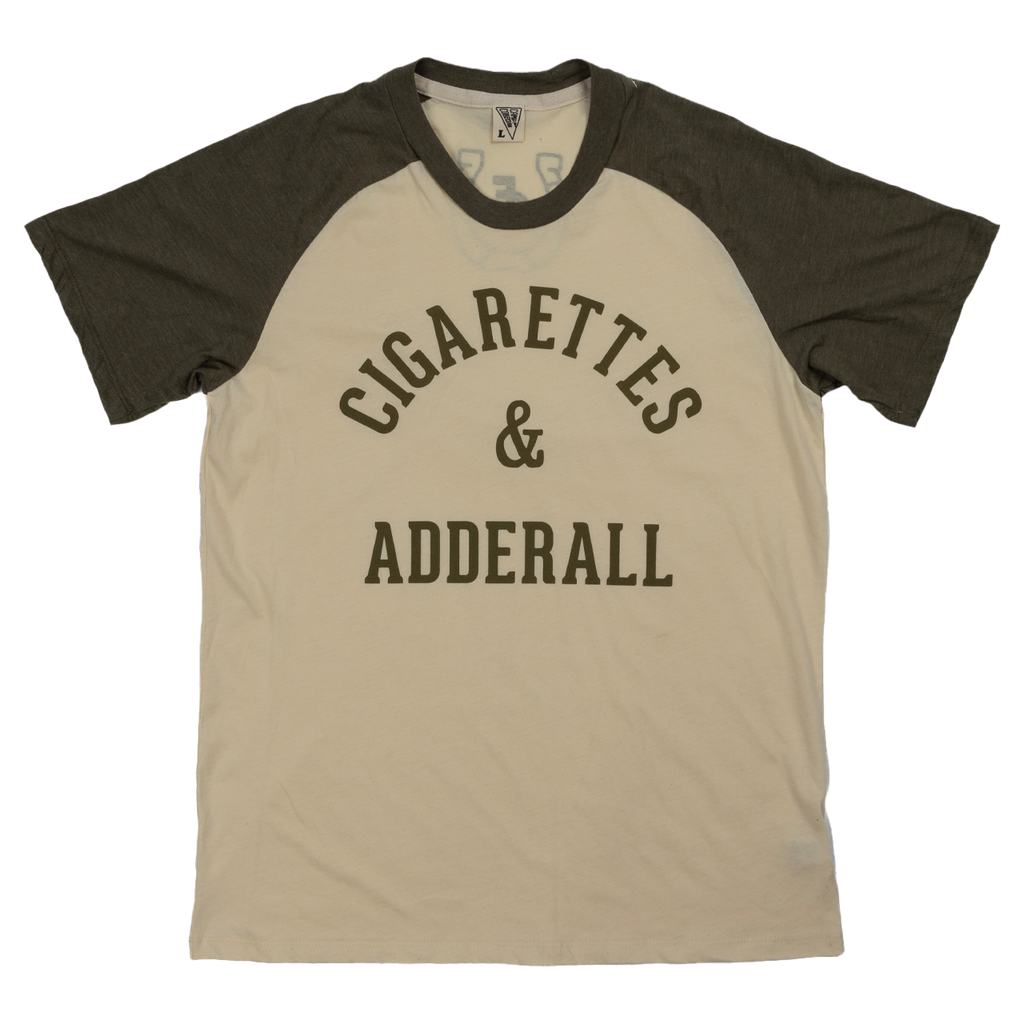 T-shirt with ’CIGARETTES & ADDERALL’ printed on the front in dark lettering.