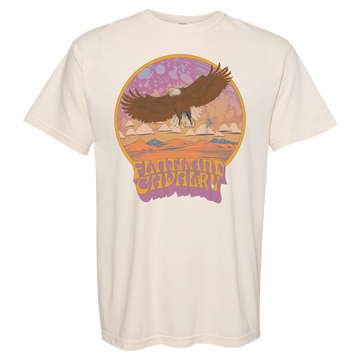 Cream-colored t-shirt featuring a retro-style graphic of an eagle soaring over a desert landscape.