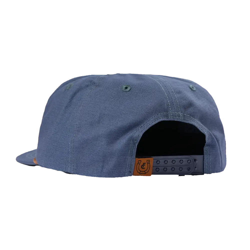 Blue baseball-style cap with a flat brim and adjustable back strap.