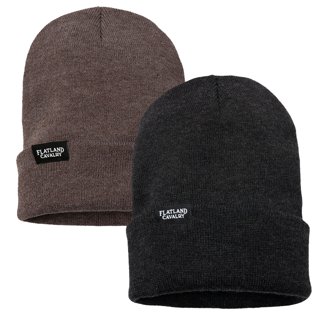 Two knit beanies, one brown and one black, with ’Flatland Cavalry’ tags.