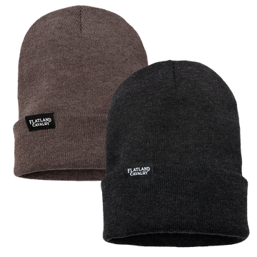 Two knit beanies, one brown and one black, with ’Flatland Cavalry’ tags.