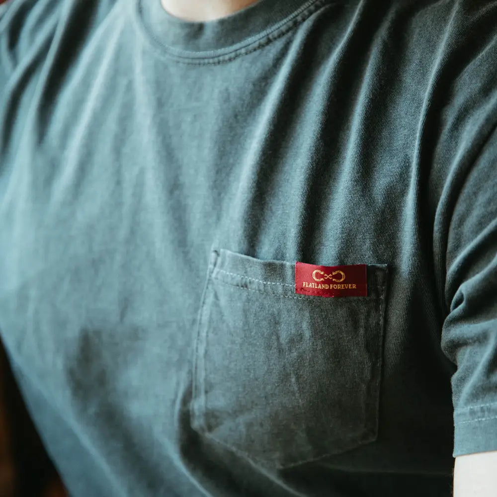 Green t-shirt with pocket.