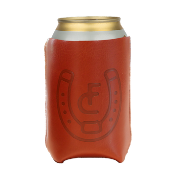 Red foam beverage cooler sleeve with a horseshoe design, holding a gold-topped can.