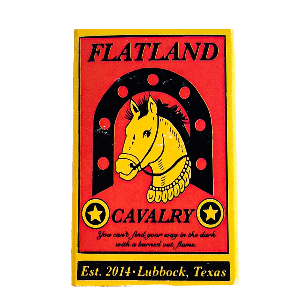 Colorful patch or emblem featuring a yellow horse head within a horseshoe shape on a red background.