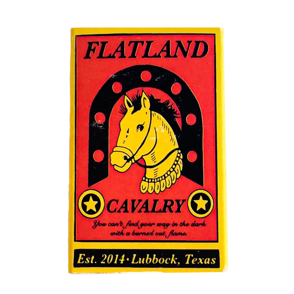 Colorful patch or emblem featuring a yellow horse head within a horseshoe shape on a red background.