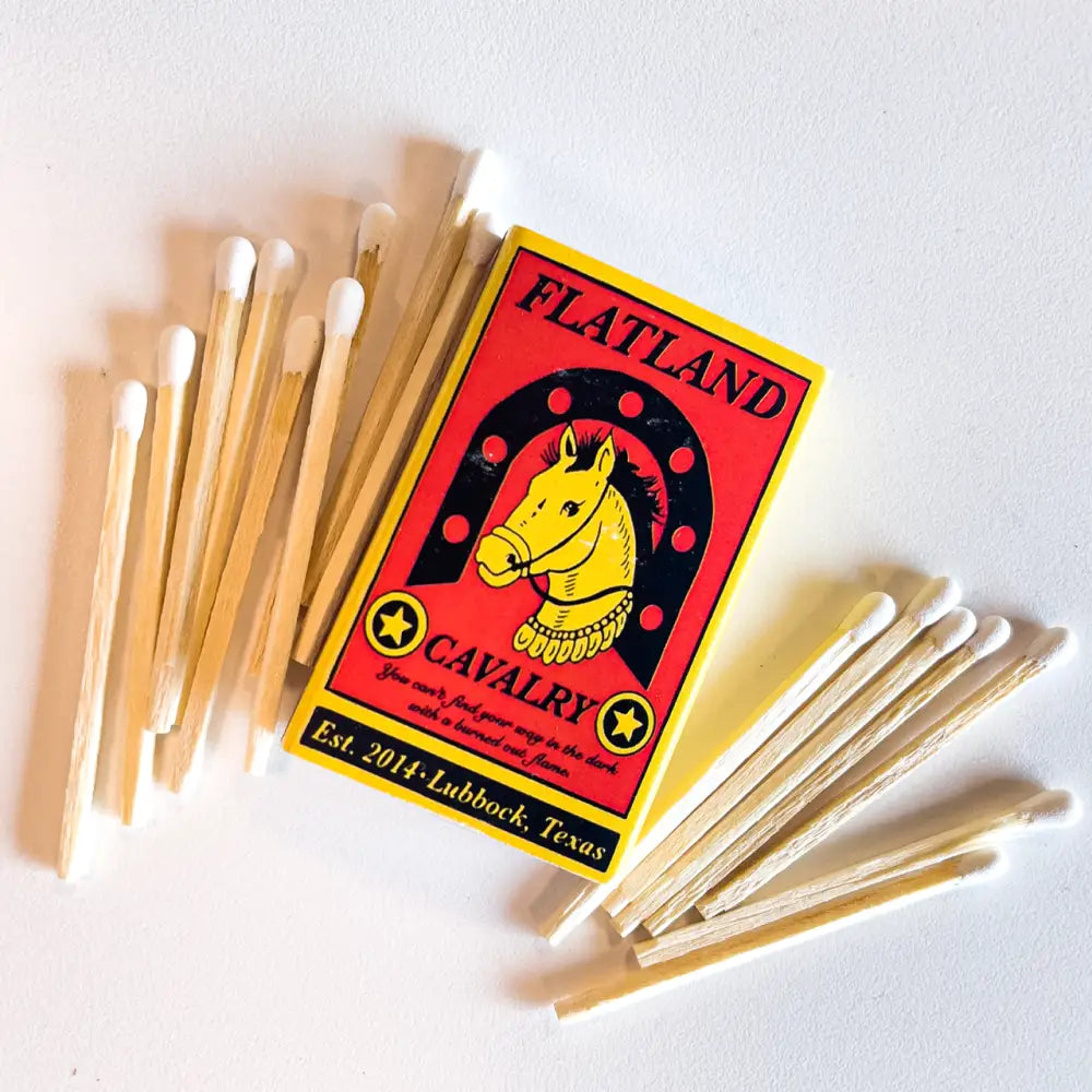 Box of Flatland Cavalry matches with a yellow horse head logo on a red background.