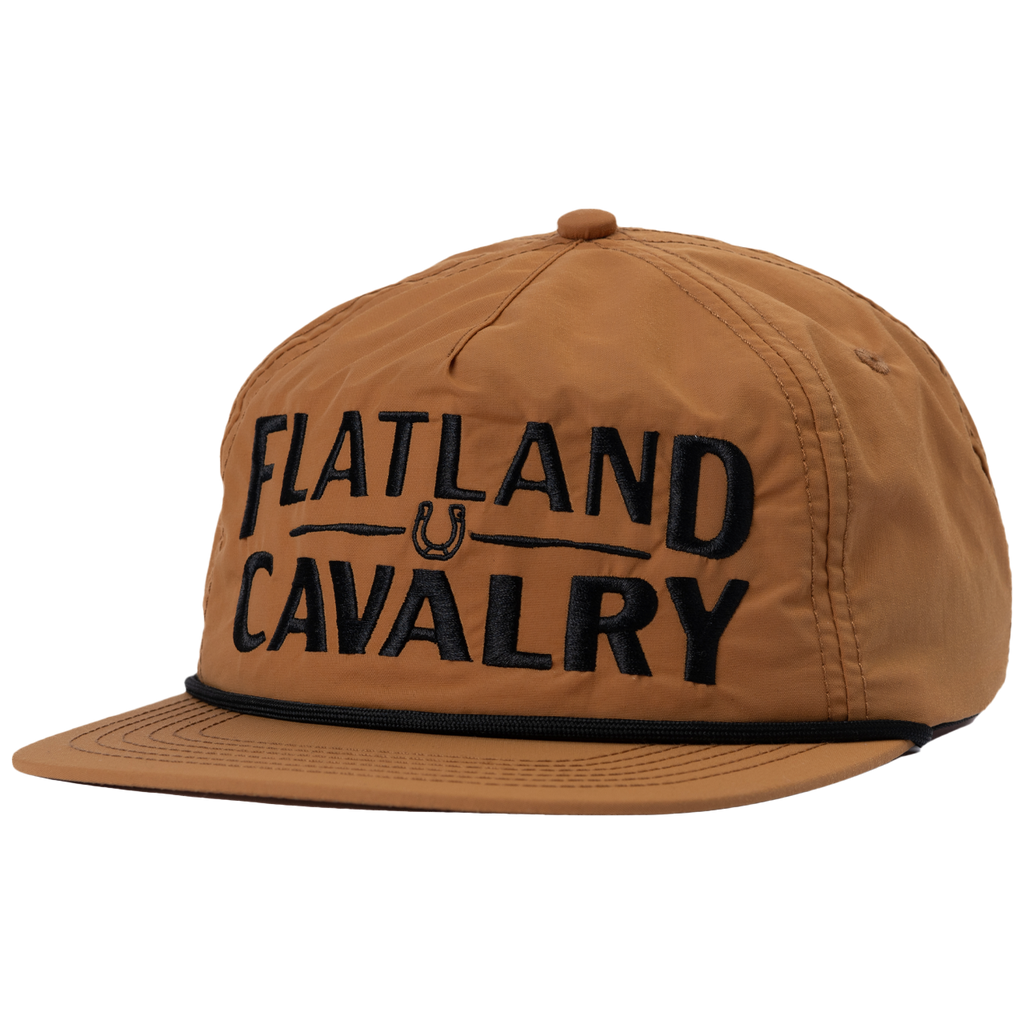 Brown baseball-style cap with ’FLATLAND CAVALRY’ text embroidered on the front.