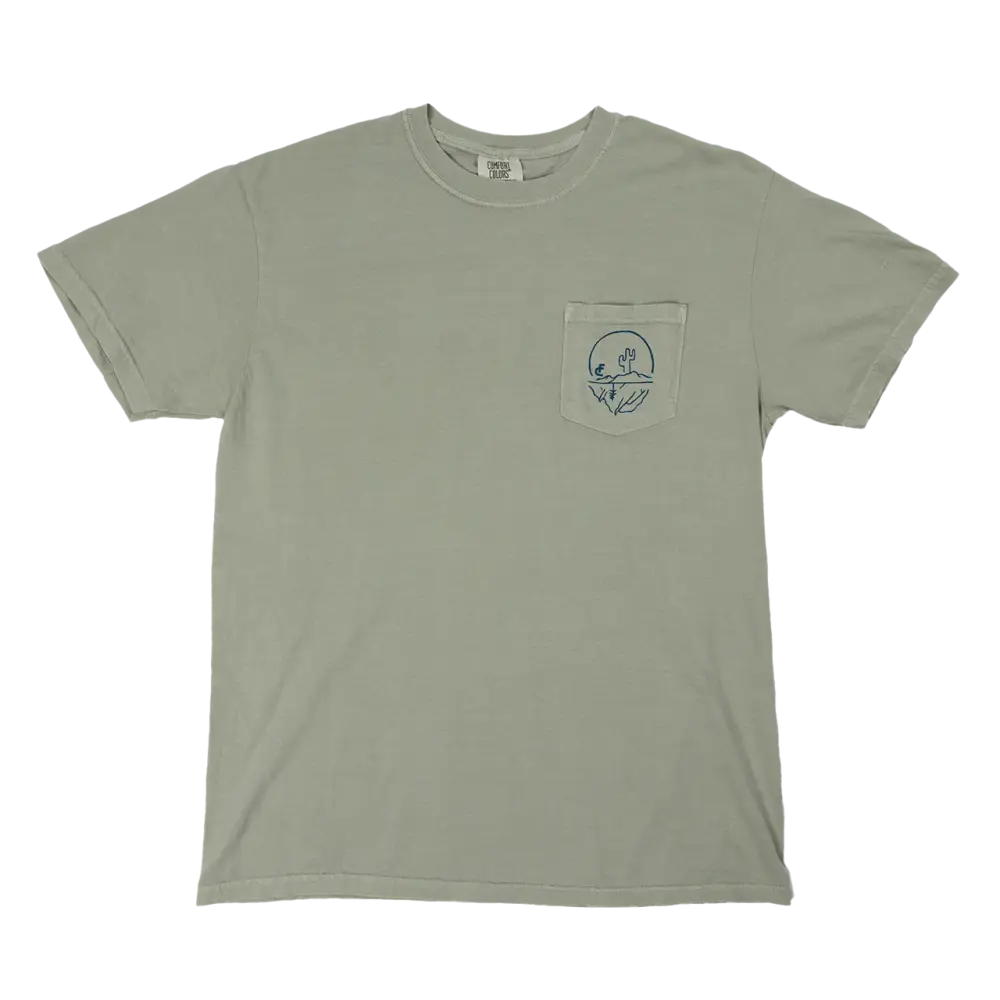 Light green t-shirt with a small pocket featuring a circular design.