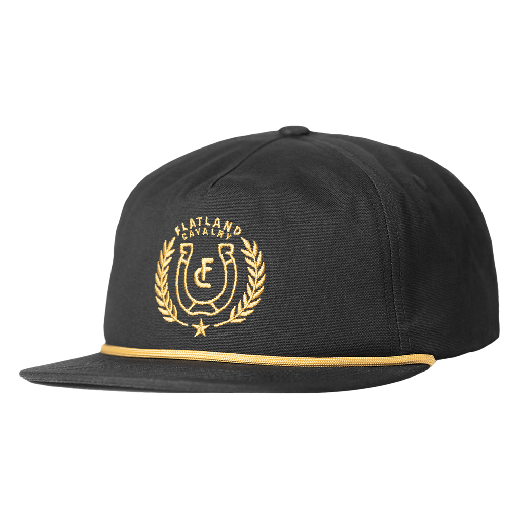 Black snapback cap with gold embroidered logo featuring a horseshoe and laurel wreath design.