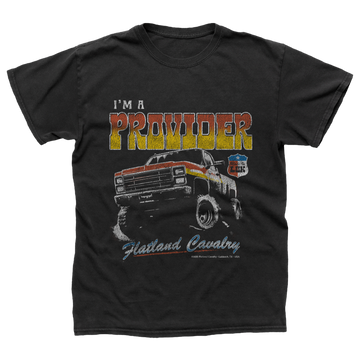 Black t-shirt with a vintage-style graphic design featuring a pickup truck and the text ’I’M A PROVIDER’ and ’Flatland Cavalry’.