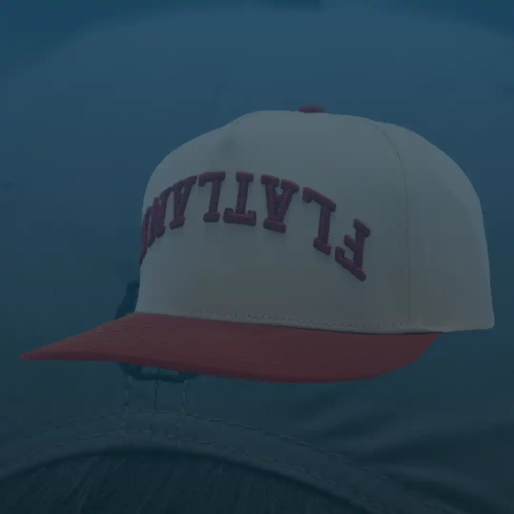 Red-brimmed baseball cap.