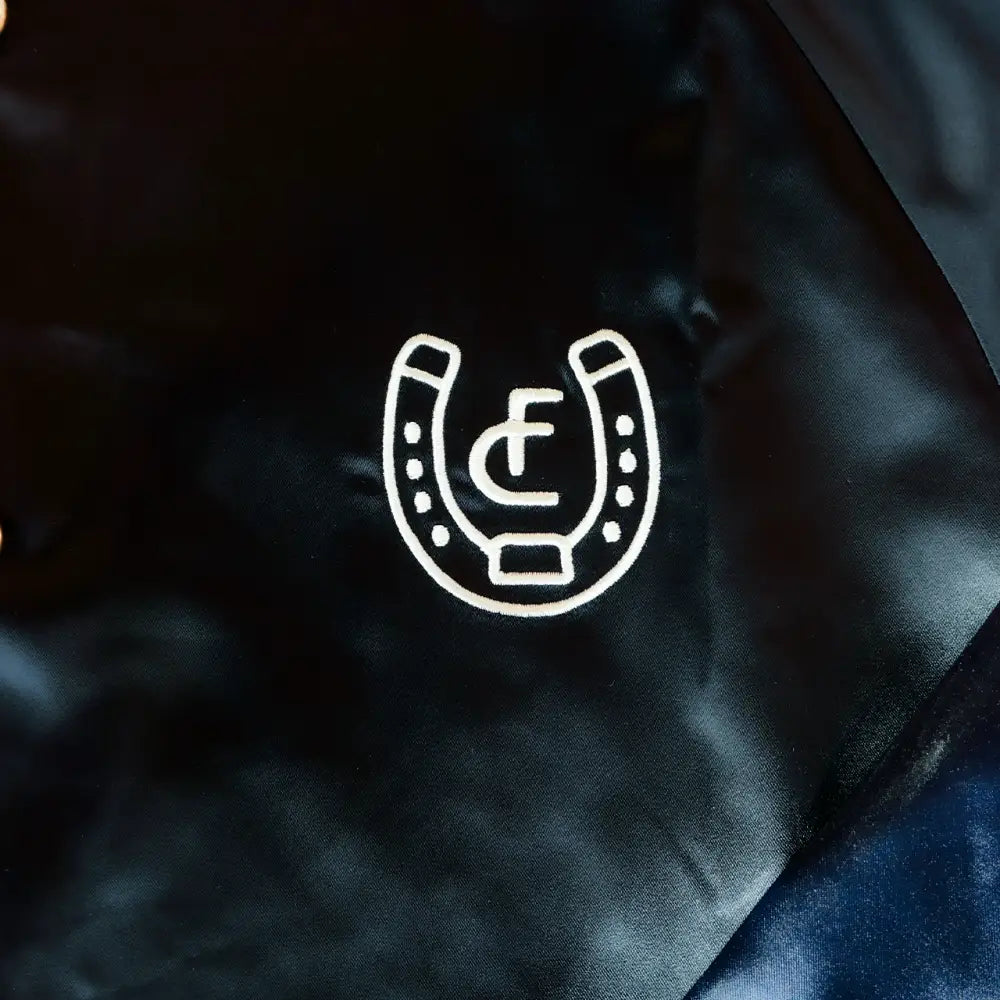 White horseshoe logo.