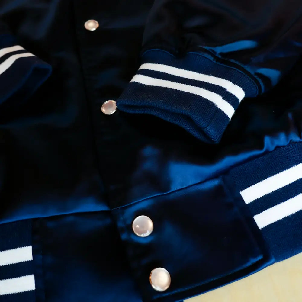 Navy blue satin bomber jacket.