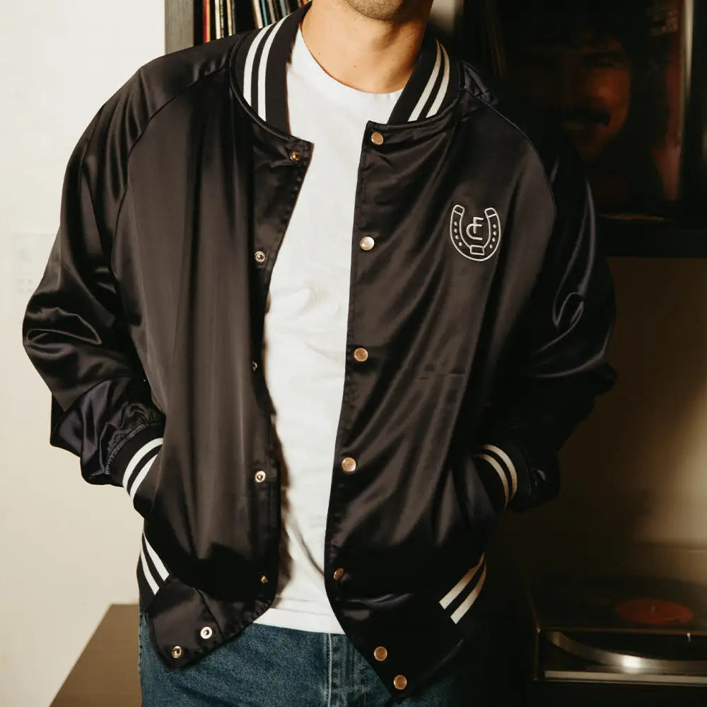 Black satin varsity jacket.