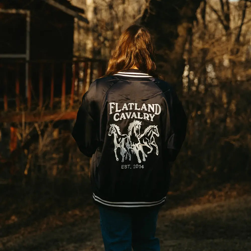 Black jacket with horse design.