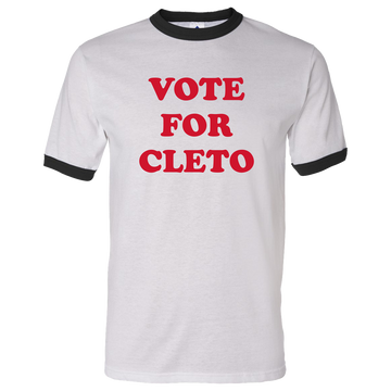 White t-shirt with black trim and red text reading ’VOTE FOR CLETO’.