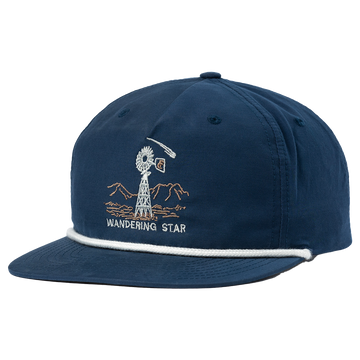 Navy blue baseball cap with an embroidered ’Wandering Star’ design featuring a giraffe and mountains.