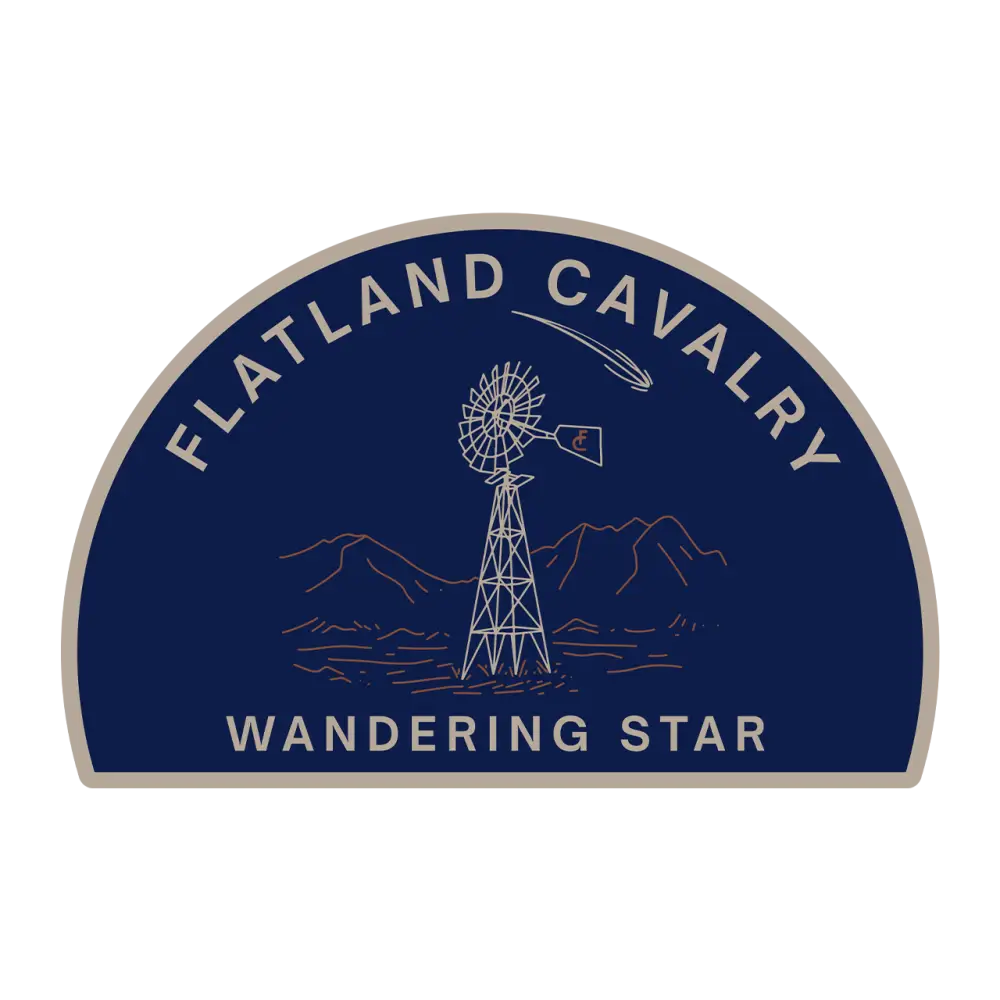 Semicircular logo sticker featuring a windmill and mountains with text ’Flatland Cavalry Wandering Star’.