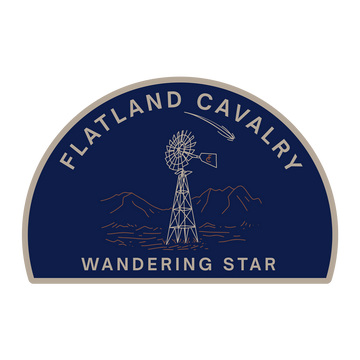 Semicircular logo patch featuring a windmill and mountains with text ’Flatland Cavalry Wandering Star’.