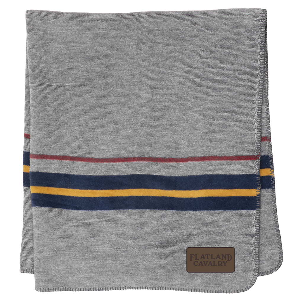 Gray blanket or throw with colorful striped accents and a leather patch.