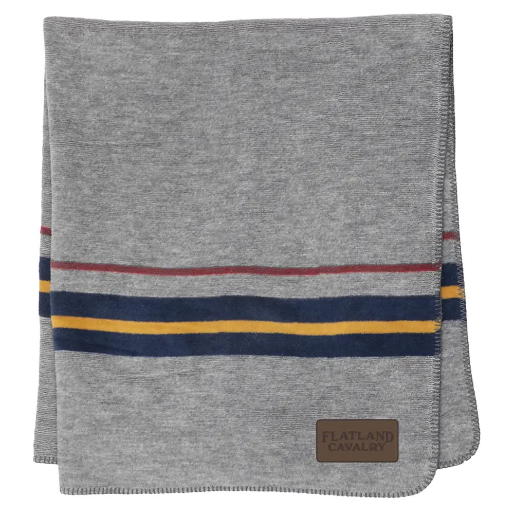 Gray blanket or throw with colorful striped accents and a leather patch.